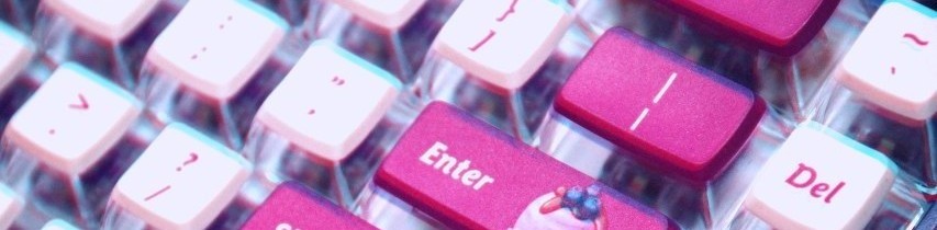 A closeup of a pastel pink mechanical keyboard. The Enter key has what looks like a little cream pastry on it, with berries on top. The image has been edited to have a pink tint to match the style of the website, and it has a slight rgb split glitch applied.